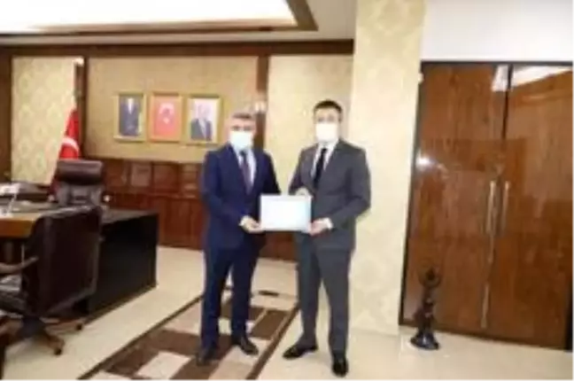 Kaymakam Alkan'dan Başkan Şayir'e teşekkür belgesi