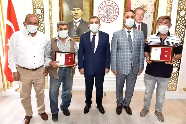 Karaman'da hayırseverlere madalya ve berat belgeleri verildi