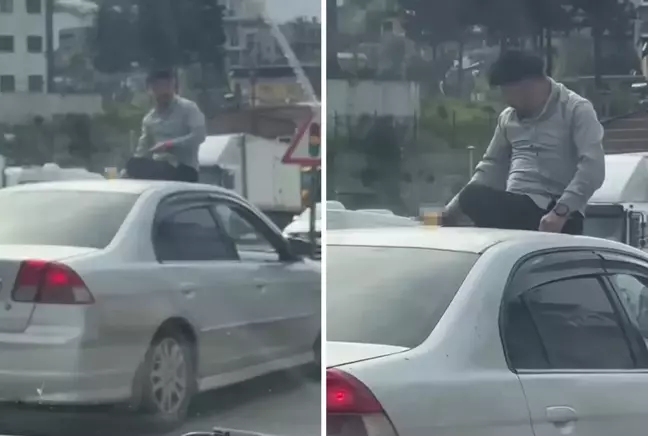 Seyir halindeki otomobilin üzerine oturup içki içti