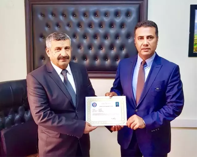 Müdür Doğan'a Üstün Başarı Belgesi