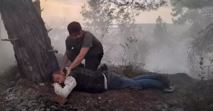 Antalya'da orman yangınını çıkaran şahıs, küle dönen alanın ortasında yerde yatarken bulundu