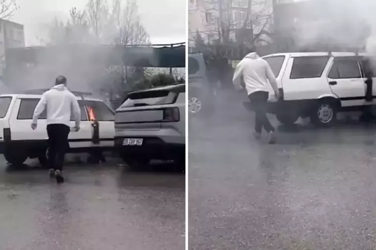 Yanan otomobile yol kenarındaki su birikintisinden doldurduğu kovayla müdahale etti