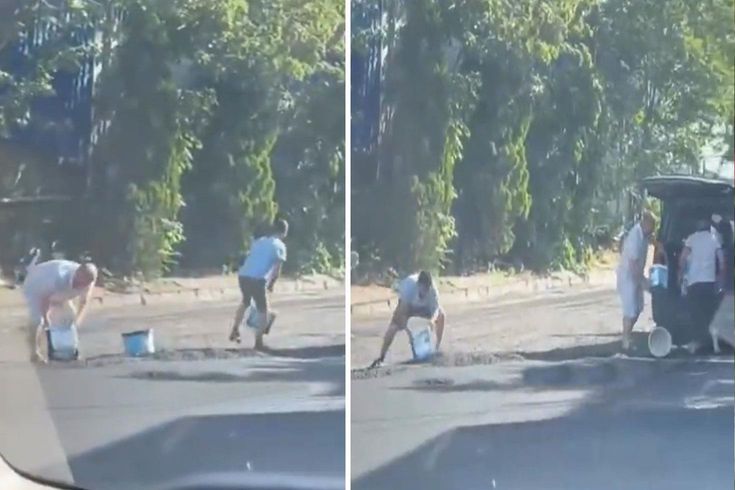 Yola yeni dökülen sıcak asfaltı kovalarla çaldılar