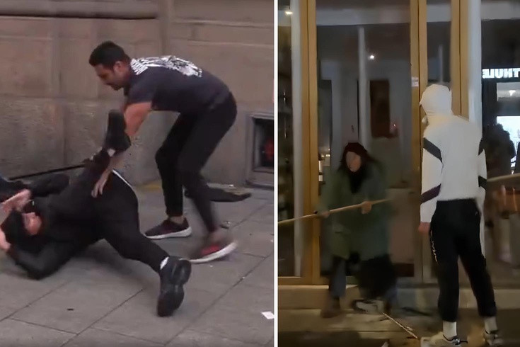 The shopkeeper tried to protect his shop from looters with a stick.