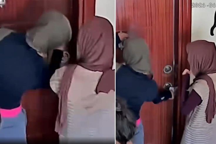 Eve girmeye çalışan hırsızlar kamerayı fark edince binadan kaçtı
