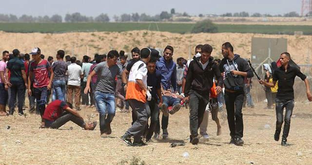 İsrail Askerleri, Anadolu Ajansı Foto Muhabirini Gerçek Mermiyle Vurarak Yaraladı
