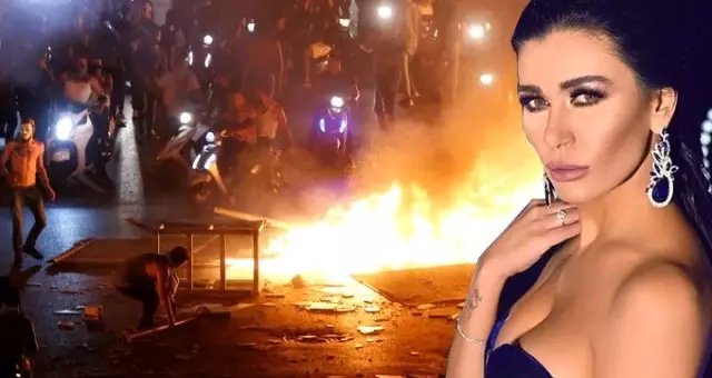 Lübnanlı ünlü oyuncu Nadine Al Rassi vergi protestolarına katıldı, lastik yaktı Lübnanlı ünlü oyuncu Nadine Al Rassi vergi protestolarına katıldı, lastik yaktı