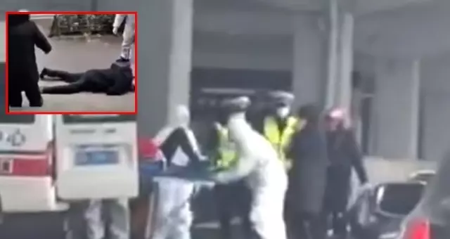 Karantina'ya alınan Wuhan'da koronavirüsüne yakalanan iki kişi sokak ortasında yere yığıldı Karantina'ya alınan Wuhan'da koronavirüsüne yakalanan iki kişi sokak ortasında yere yığıldı