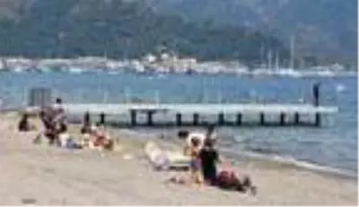 Marmaris'te güneşi gören sahile koştu Marmaris'te güneşi gören sahile koştu