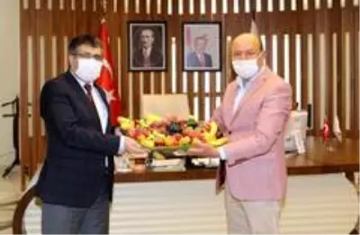 Pazarcılar Odası Başkanı Özmen'den Rektör Aktekin'e ziyaret Pazarcılar Odası Başkanı Özmen'den Rektör Aktekin'e ziyaret