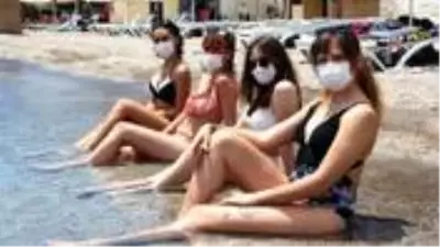 Maskeli ve sosyal mesafeli deniz keyfi renkli görüntülere sahne oldu Maskeli ve sosyal mesafeli deniz keyfi renkli görüntülere sahne oldu