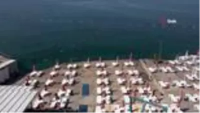 Antalya'nın mavi bayraklı falez plajları pandemi kurallarıyla açıldı Antalya'nın mavi bayraklı falez plajları pandemi kurallarıyla açıldı