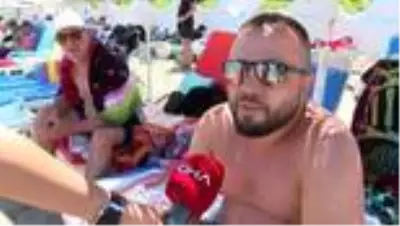 İZMİR Çeşme Ilıca Plajı'nda bayram yoğunluğu İZMİR Çeşme Ilıca Plajı'nda bayram yoğunluğu