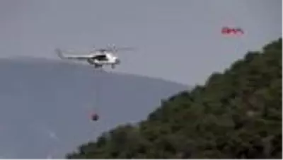 MANİSA Ahmetli'deki yangında soğutma çalışmaları havadan ve karadan sürüyor MANİSA Ahmetli'deki yangında soğutma çalışmaları havadan ve karadan sürüyor