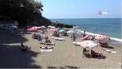 Günübirlik tatilciler deniz ve sahilin tadını doyasıya çıkarttı Günübirlik tatilciler deniz ve sahilin tadını doyasıya çıkarttı