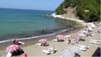 Günübirlik tatilciler deniz ve sahilin tadını doyasıya çıkarttı Günübirlik tatilciler deniz ve sahilin tadını doyasıya çıkarttı