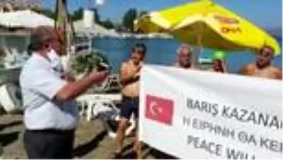 MUĞLA Datça'da kulaçlar, dünya barışı için atıldı MUĞLA Datça'da kulaçlar, dünya barışı için atıldı