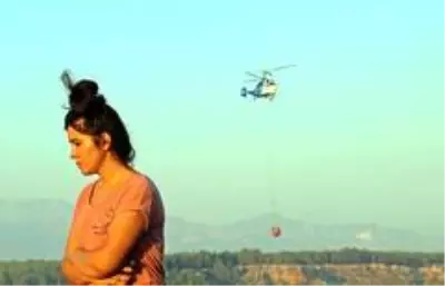 Evlerine yakın bölgede çıkan orman yangınından panikle kaçtılar Evlerine yakın bölgede çıkan orman yangınından panikle kaçtılar