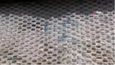 Pandemi sürecinde kullanılan 2 bin 450 maske ile duvar kaplandı Pandemi sürecinde kullanılan 2 bin 450 maske ile duvar kaplandı