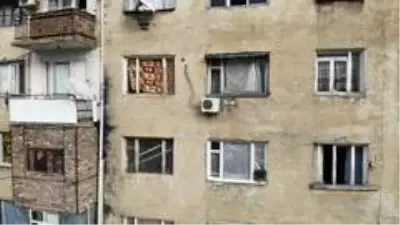 Son dakika haberi | - Gence'de füze saldırısı sonucu camları kırılan savaşzedeler kırılan camlarını naylon ve kilimle örttü Son dakika haberi | - Gence'de füze saldırısı sonucu camları kırılan savaşzedeler kırılan camlarını naylon ve kilimle örttü