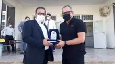 Öğrencilere ayakkabı ve mont hediye edildi Öğrencilere ayakkabı ve mont hediye edildi