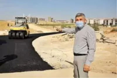 Osmangazi Mahallesi'nde yeni açılan yollar asfaltlanıyor Osmangazi Mahallesi'nde yeni açılan yollar asfaltlanıyor