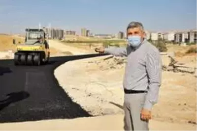 Osmangazi Mahallesi'nde yeni açılan yollar asfaltlanıyor Osmangazi Mahallesi'nde yeni açılan yollar asfaltlanıyor