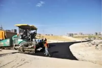 Osmangazi Mahallesi'nde yeni açılan yollar asfaltlanıyor Osmangazi Mahallesi'nde yeni açılan yollar asfaltlanıyor