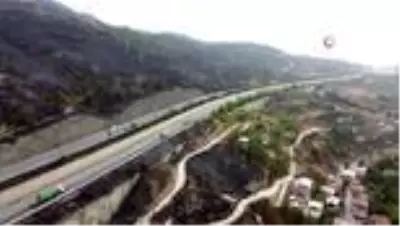Alevlerin arasında kalan Azganlık Şehitliği ise yangında etkilenmedi Alevlerin arasında kalan Azganlık Şehitliği ise yangında etkilenmedi