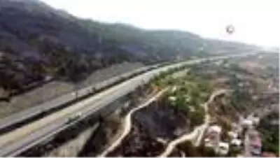Alevlerin arasında kalan Azganlık Şehitliği ise yangında etkilenmedi Alevlerin arasında kalan Azganlık Şehitliği ise yangında etkilenmedi