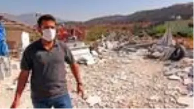 Yangın sırasında belediyenin dozerinin iş yerine zarar verdiği iddiası Yangın sırasında belediyenin dozerinin iş yerine zarar verdiği iddiası