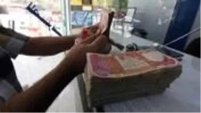 Irak, 17 yıl sonra devalüasyon kararı aldı Irak, 17 yıl sonra devalüasyon kararı aldı