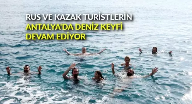 Rus ve Kazak turistlerin Antalya'da deniz keyfi devam ediyor Rus ve Kazak turistlerin Antalya'da deniz keyfi devam ediyor