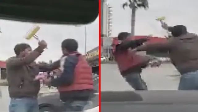 Madde bağımlıları, ışıkta bekleyen otomobillerin camını silmek için yumruk yumruğa kavga etti Madde bağımlıları, ışıkta bekleyen otomobillerin camını silmek için yumruk yumruğa kavga etti
