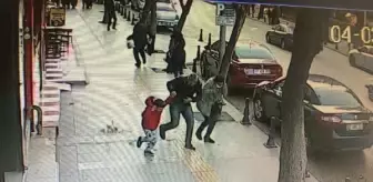 Binadan kopan taş parçalarının çocuğun başına düşmesi kamerada