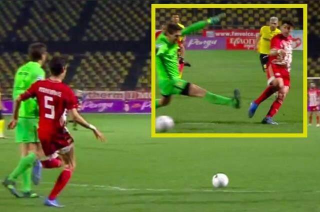 Awake football player, hiding next to the goal post, caught the goalkeeper by surprise