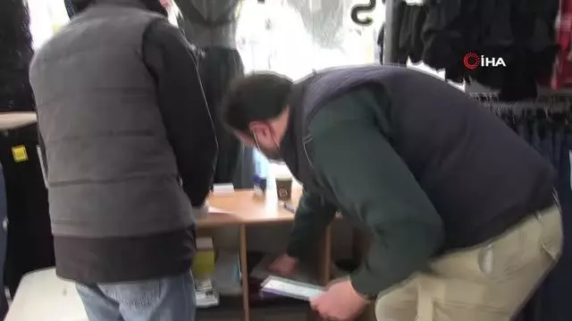 Almanya'da mağazalara girişlerde test sonucu gösterme zorunluluğuna esnaf tepkili
