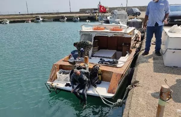 GÖKÇEADA BELEDİYE BAŞKANI ÇETİN, DALIŞ YAPARAK DENİZİ TEMİZLEDİ