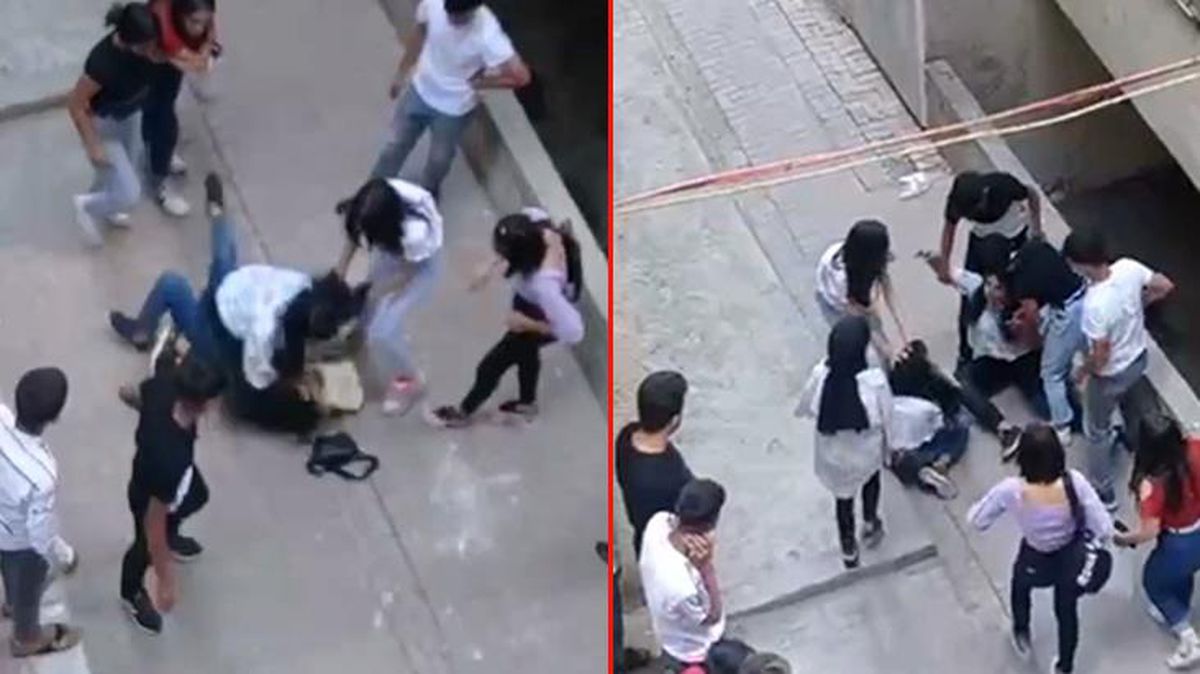 Genç kızlar sokak ortasında tekme tokat birbirine girdi! Erkekler film izler gibi izledi