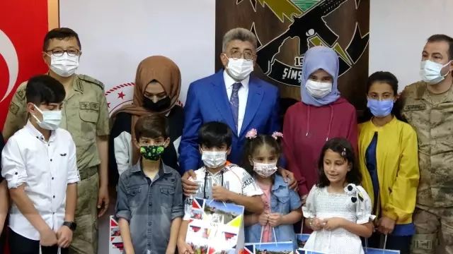 Van'da güvenlik korucusu ve ailelerine kitap dağıtımı