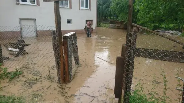 He carried his disabled neighbor on his back out of the flooded house