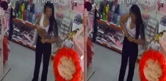 Genç kadın, parti malzemelerini pantolonun içine saklayıp çaldı! Kalpli mum hırsızı kameralardan kaçamadı