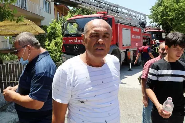 EVİNDE YANGIN ÇIKAN KOMŞUSUNU KURTARDI