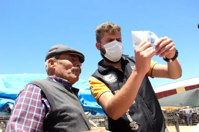 Karaman'da kurban pazarında broşürlü sahte para uyarısı