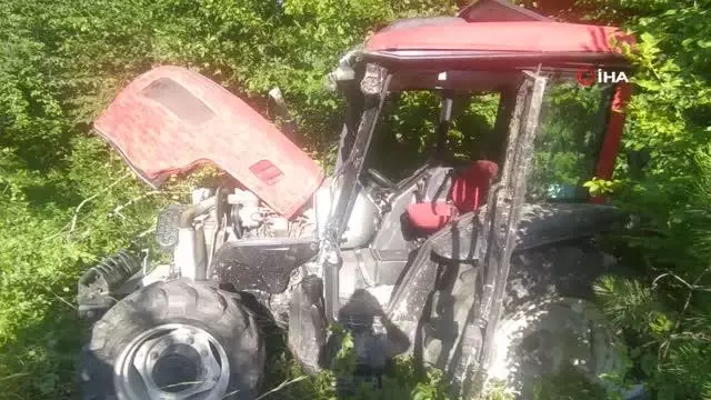 Ot biçerken traktörle uçuruma yuvarlandı Ot biçerken traktörle uçuruma yuvarlandı