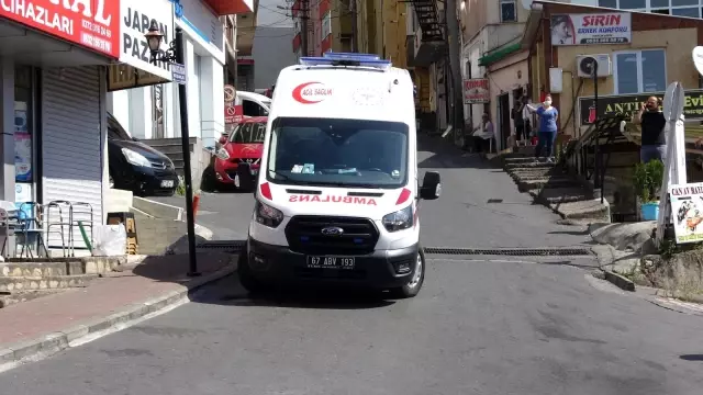 Maaşını alamayınca çalıştığı binanın çatısına çıktı