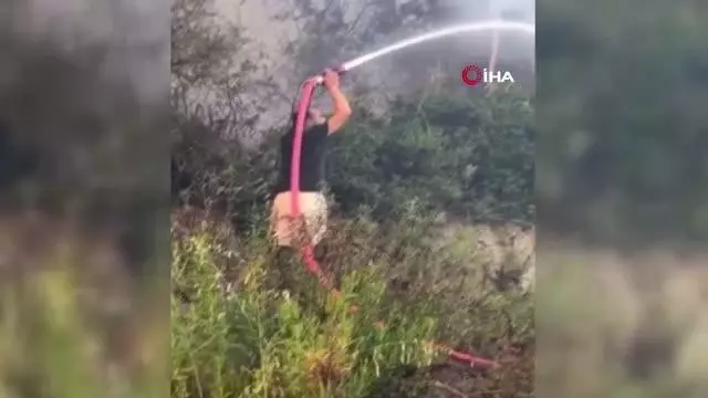 Tatile giden Adanalı gençler, yangına müdahale etti