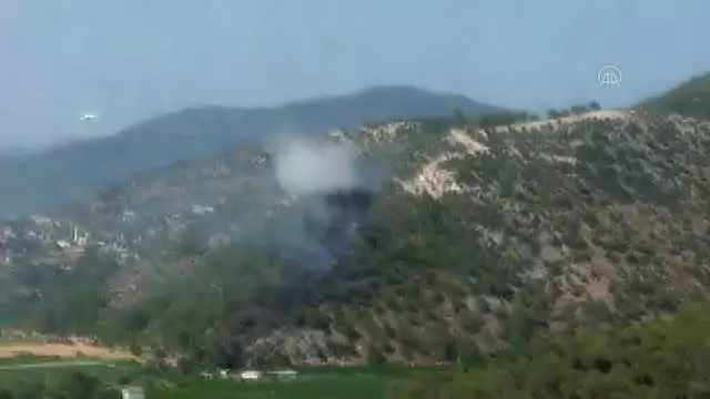Dalaman Havalimanı yakınlarında çıkan orman yangını kontrol altına alındı