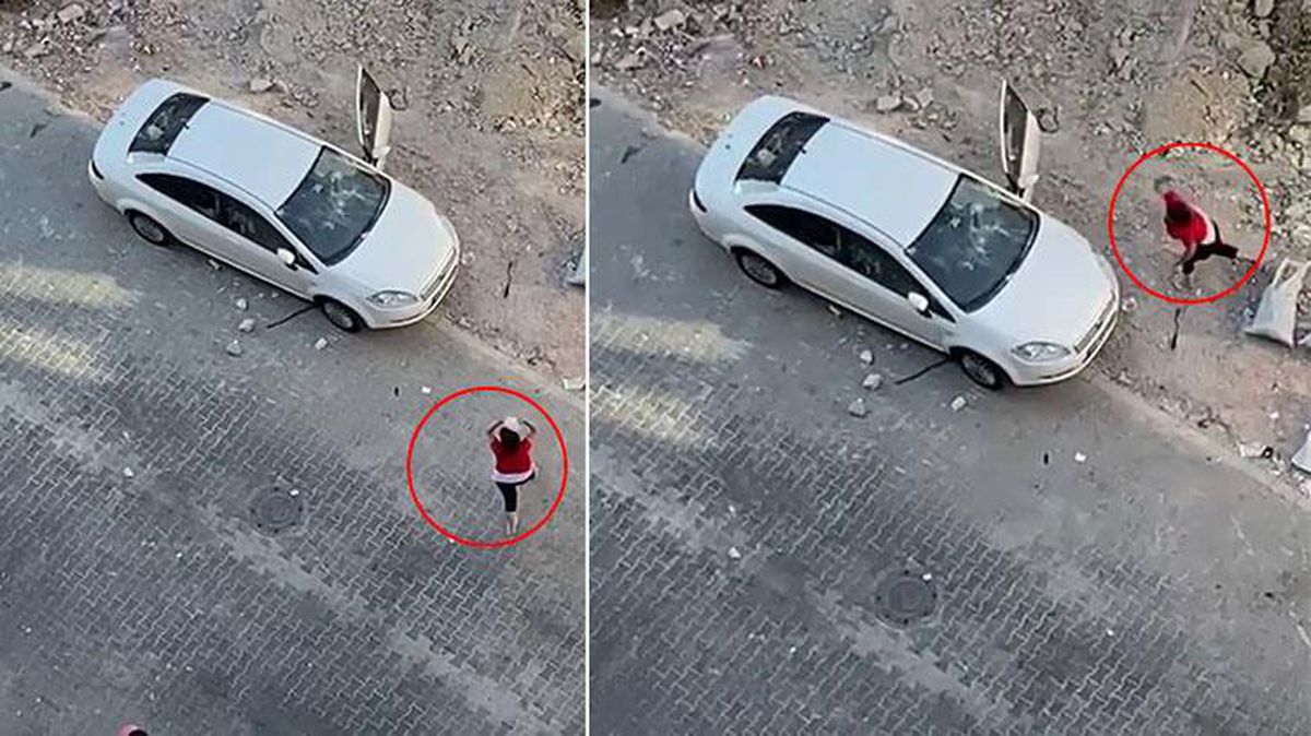 Öfkeli kadın sokak ortasında terör estirdi! Kendisini dolandıran kişinin aracını taş yağmuruna tuttu