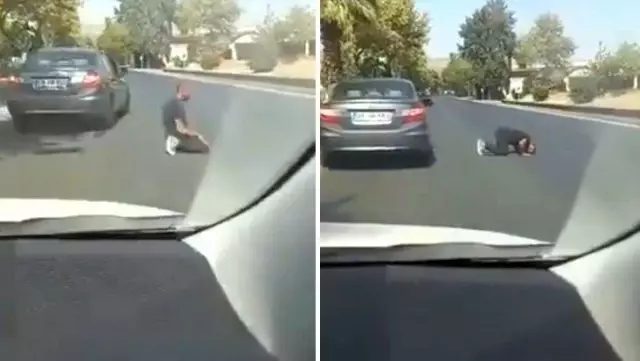 Image from Turkey!  He prays in the middle of the road and ignores the flowing traffic.